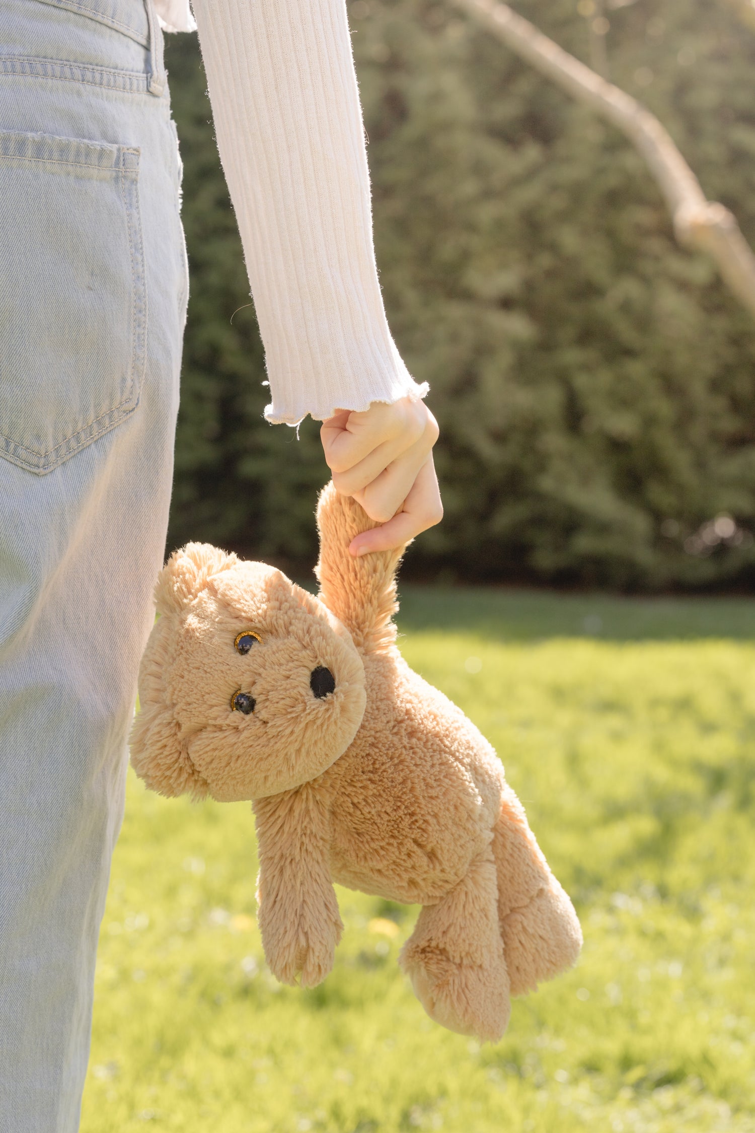 Child holding an adopted stuffed animal – sustainable comfort toy from Bear Hug Adventures Co.